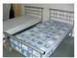 Single bedsteads and mattresses. 2 identical single beds....
